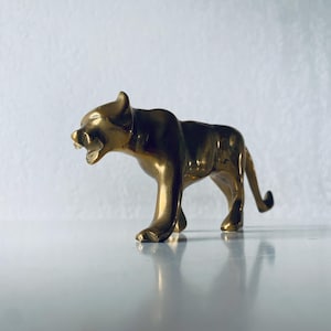 Lioness in gilded brass