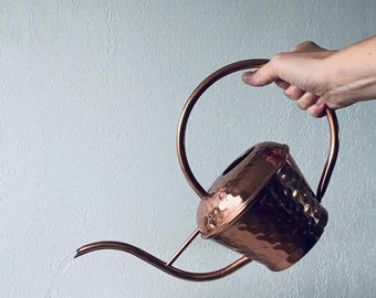 Antique copper watering can