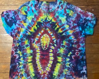 May include: A tie-dye t-shirt with a circular pattern in shades of blue, green, yellow, red, and purple.