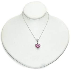 May include: A silver necklace with a heart-shaped pendant. The pendant is encrusted with small, red and white gemstones. The necklace is displayed on a white bust.