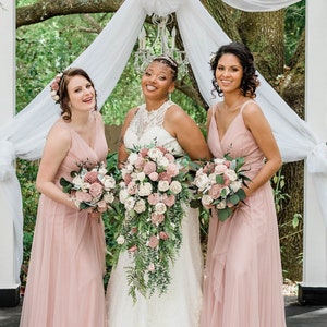 Blushing Rose sola wood flower bridal and bridesmaid bouquet with soft pink, light blush, and white flowers, medium green foliage leaves, fully wrapped, forever lasting.