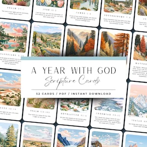 May include: A set of scripture cards with watercolour landscape art and Bible verses. The cards are white with colourful illustrations. The text "A Year With God Scripture Cards" is displayed on a light blue background.