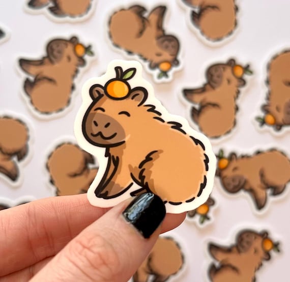 Mini Capybara Sticker | cute animal sticker | capybara with an orange sticker | happy capybara sticker | kawaii animals sticker | zoo animal