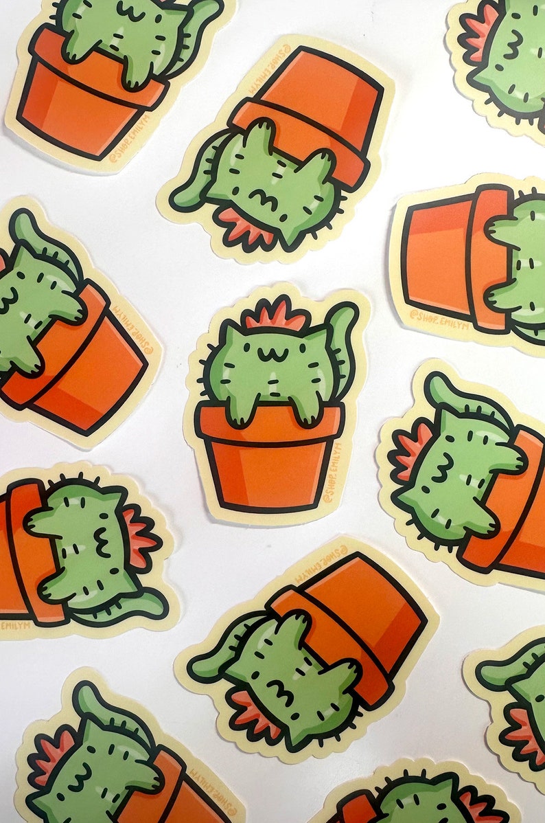 May include: A set of nine stickers featuring a cartoon cat dressed as a cactus in a terracotta pot. The stickers are on a white background. The cat is green and has a pink flower on its head. The pot is orange. The stickers are all different sizes and shapes.