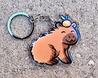 Capybara Schlüsselanhänger | Süßer Acryl Schlüsselanhänger | Kawaii Tier Schlüsselanhänger | Heiße Quelle Wasserschwein | Wasserschwein mit einer Mandarine | Wasserschwein Geschenk