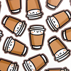 May include: A collection of brown and white cartoon coffee cups with happy faces. The cups are arranged in a random pattern on a white background.