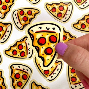 May include: A set of colorful pizza slice stickers with a cartoon-style design. The stickers feature a yellow crust, red pepperoni, and green peppers. One sticker has a face with a smiley expression and the text "TUT".