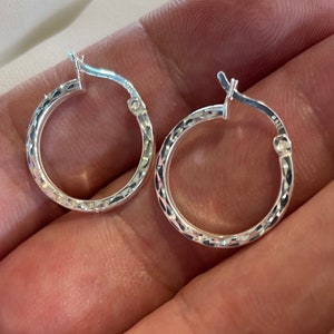 Sterling Silver Hoop Earrings - Silver 15 mm Dia Cut Hoop Earrings 1.6 Grams **Attention:** Earrings are sold in pairs or as single pieces.