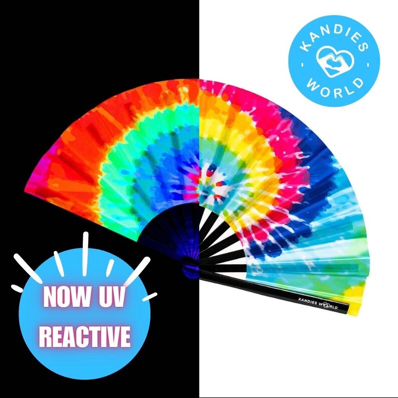 May include: A colorful tie-dye hand fan with a black handle. The fan is open and the design is a swirl of rainbow colors. The text "KANDIES WORLD" is on the handle and a blue circle with a heart and the text "KANDIES WORLD" is in the upper right corner. The text "NOW UV REACTIVE" is in a blue circle in the lower left corner.