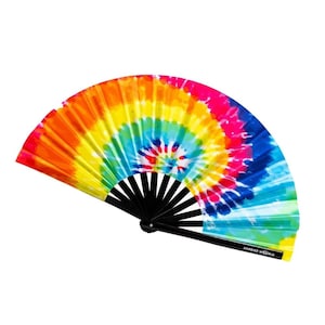 May include: A colorful tie-dye hand fan with a black handle. The fan features a swirling pattern of pink, orange, yellow, green, blue, and purple.
