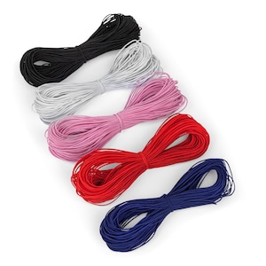 May include: Five spools of elastic cord in different colors: black, white, pink, red, and blue. The spools are arranged in a stack, with the black spool on top and the blue spool on the bottom.