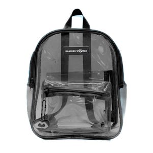 May include: A clear plastic backpack with black straps and a black zipper. The backpack has a black label that says "KANDIES WORLD".