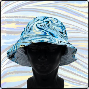 May include: A blue, black, and white bucket hat with a marbled pattern.