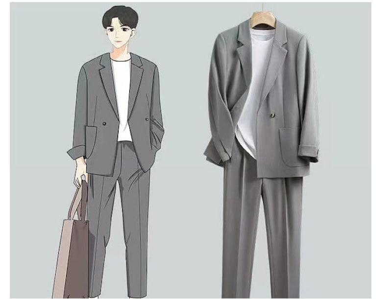 May include: A gray suit with a double-breasted blazer and matching pants. The suit is shown on a mannequin and a person wearing the suit.