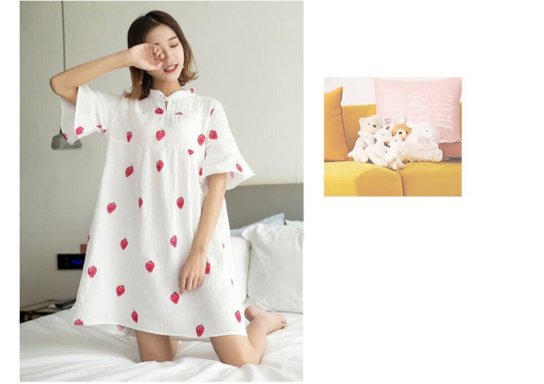 May include: A white cotton nightgown with a strawberry print. The nightgown has a mandarin collar and short sleeves.