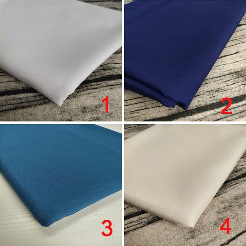 May include: Four fabric swatches in different colors: white, navy blue, teal blue, and beige. The swatches are arranged in a grid pattern.