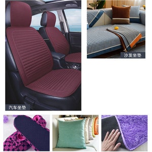 May include: A set of three car seat covers in a deep burgundy color. The covers are made of a soft, textured fabric and have a quilted design. The covers are shown in a car, with the front seats covered. The text "汽车坐垫" is visible in the image, which translates to "car seat cover" in English.