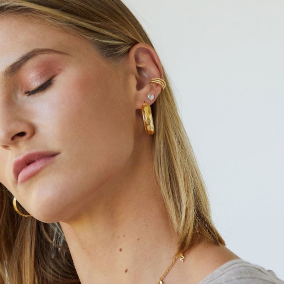 ASOS DESIGN waterproof stainless steel clicker hoop earrings in gold tone  with gift bag | ASOS