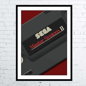 May include: A black and red illustration of a Sega Master System II video game console. The console is angled to show the front and top of the device. The text "SEGA Master System II" is printed in white on a black background.