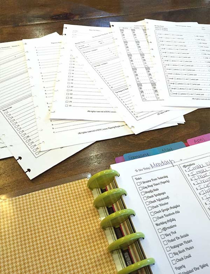 May include: A close-up of a green and gold planner with a checklist for the day. The checklist includes tasks such as "Check Instagram Picture" and "Check Email".