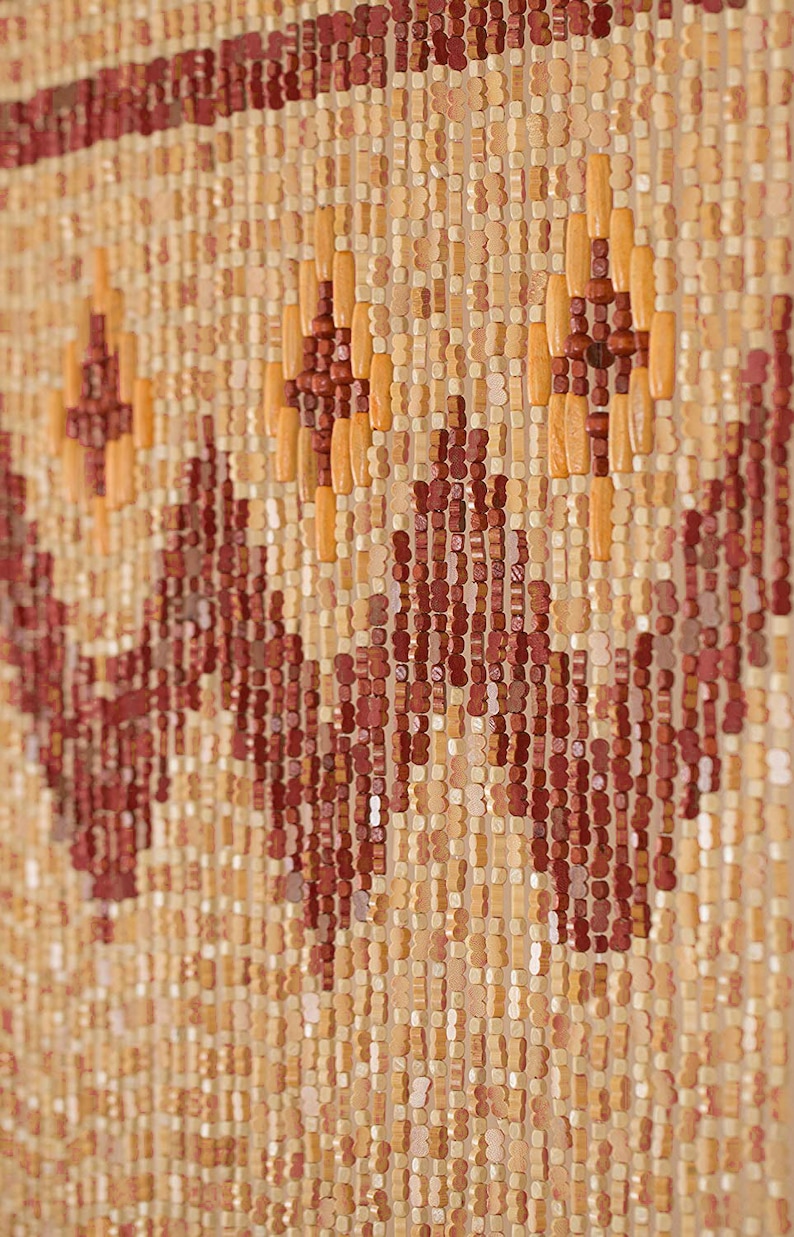 May include: A beaded curtain made of wood beads in shades of brown, beige, and orange. The beads are arranged in a geometric pattern, creating a unique and decorative design.