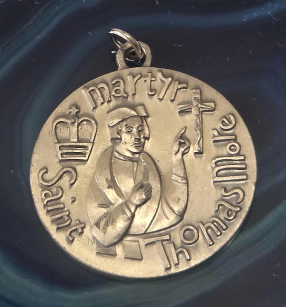 Sterling Silver St. Thomas More Martyr medal.
