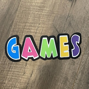 Game’s title paper piecing die cut