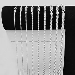 May include: An assortment of silver-coloured rope chains in different thicknesses, from 1.1mm to 5.5mm. Each chain has a clasp and is displayed against a black background. The chain sizes are labelled in millimetres.