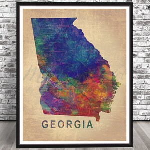 May include: A colorful watercolor illustration of the state of Georgia. The map is outlined in black and the state name is written in black text below the map.