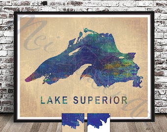 May include: Framed watercolor print of Lake Superior. The artwork features a map of the lake in shades of blue, green, and purple against a beige background. The words "LAKE SUPERIOR" are printed in a teal font.