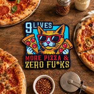 May include: A colorful patch featuring a cat wearing sunglasses and holding pizza slices. The text on the patch reads "9 LIVES MORE PIZZA & ZERO FU*KS". Several pizzas with pepperoni and other toppings are arranged around the patch.