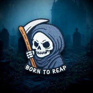 May include: Embroidered patch featuring the Grim Reaper in a gray hooded cloak, holding a scythe with a wooden handle. The patch has the text "BORN TO REAP" in white. The background is a spooky graveyard scene.