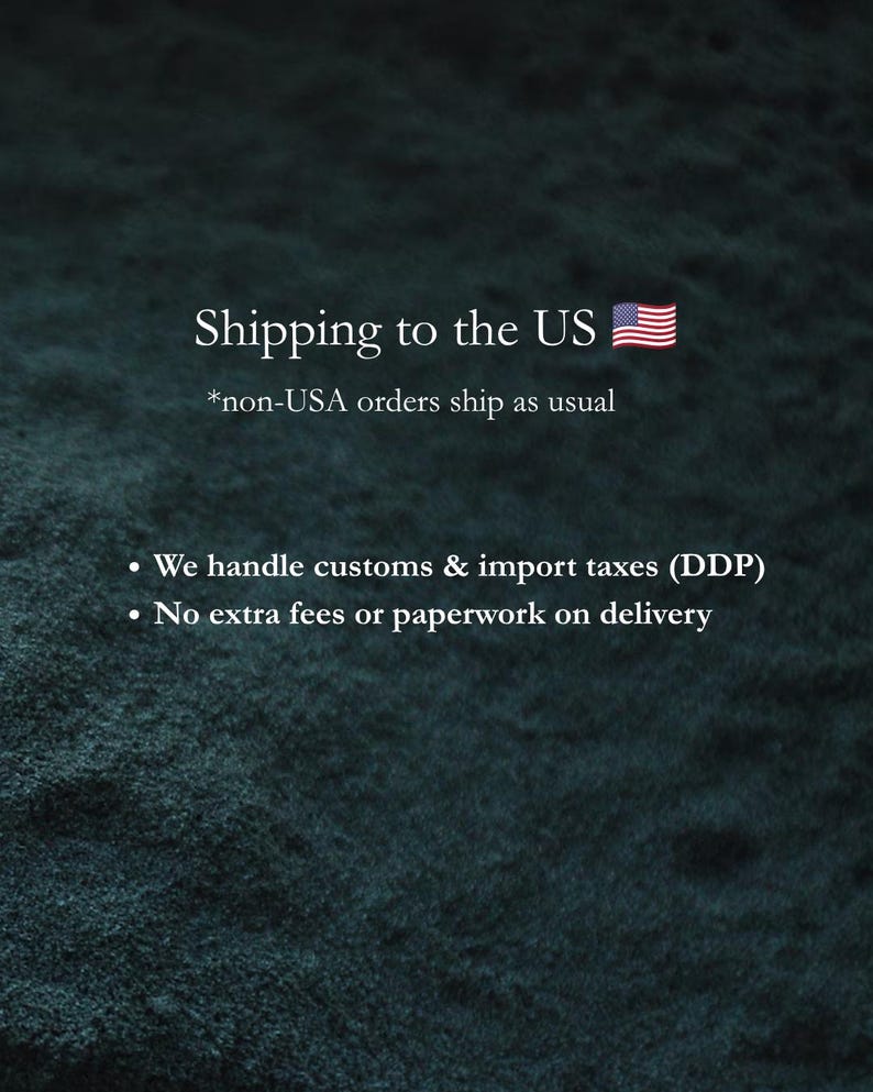 May include: A dark textured background with white text stating: Shipping to the US with a US flag icon, *non-USA orders ship as usual, We handle customs & import taxes (DDP), and No extra fees or paperwork on delivery.