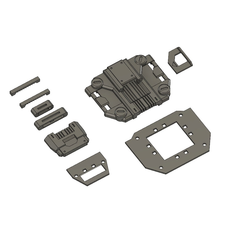 Puede incluir: Un conjunto de piezas de pl&aacute;stico gris para un modelo impreso en 3D. Las piezas incluyen una base rectangular grande, una pieza rectangular m&aacute;s peque&ntilde;a con un agujero cuadrado en el centro, una pieza rectangular peque&ntilde;a con un borde curvo y varias piezas rectangulares m&aacute;s peque&ntilde;as con dientes.