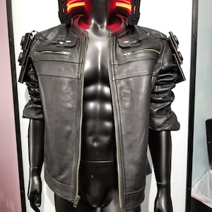 May include: A black leather jacket with a zipper closure and a red light-up collar. The jacket has a futuristic design with details on the shoulders and arms.