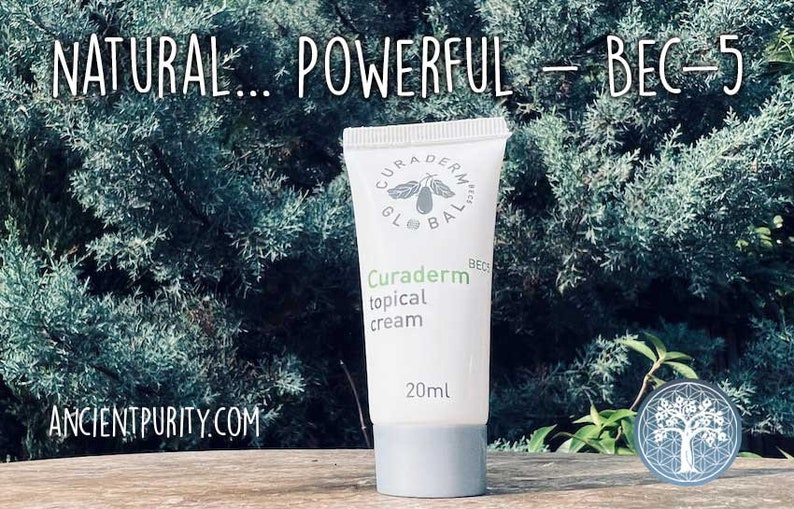 May include: A white tube of Curaderm topical cream with the text "NATURAL... POWERFUL - BEC-5". The tube has a gray cap and contains 20ml of cream. The background features green foliage and the website ANCIENTPURITY.COM.
