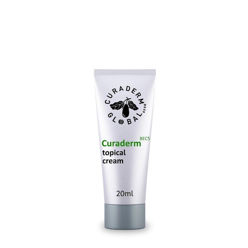 May include: A white tube of Curaderm topical cream with a gray cap. The tube features the brand name and product description in green and black text, along with a logo. The tube contains 20ml of cream.