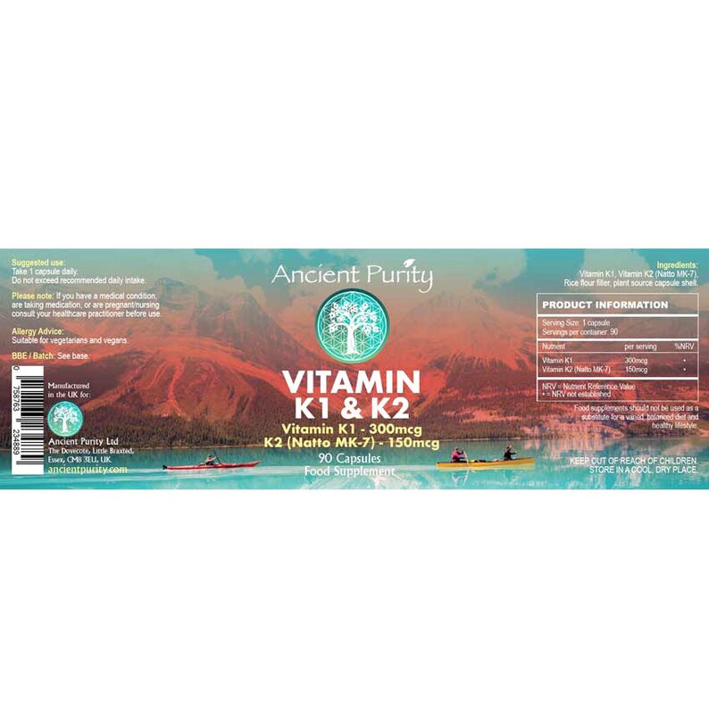 May include: A rectangular product label for Ancient Purity Vitamin K1 & K2 food supplement with 90 capsules. The label features a scenic mountain lake landscape with two kayaks, white text detailing ingredients, dosage, and a barcode on the left.
