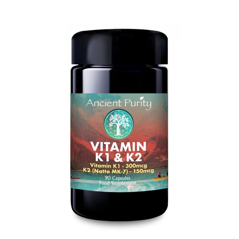 May include: A black plastic bottle of Ancient Purity Vitamin K1 & K2 food supplement. The label features a mountain lake landscape, a tree icon, and text stating Vitamin K1 - 300mcg, K2 (Natto MK-7) - 150mcg, and 90 capsules.