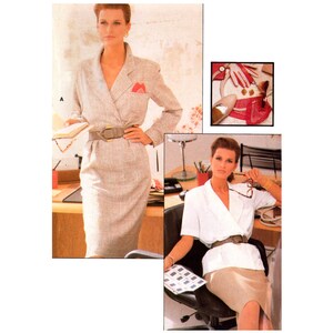 May include: Two women wearing different styles of suits. The woman on the left is wearing a beige suit with a red pocket square and a brown belt. The woman on the right is wearing a white blouse with a brown belt and a beige skirt. Both women are wearing their hair in a similar style.