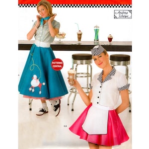 May include: A sewing pattern envelope featuring two outfits: a teal skirt with a white poodle appliqué and a white collared shirt, and a white shirt with a black and white checkered collar and cuffs paired with a pink skirt and white apron.