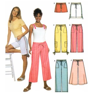 May include: A sewing pattern for five different styles of trousers. The trousers are shown in various colours and patterns, including red, white, blue, yellow, and pink.