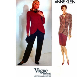 May include: A vintage sewing pattern for a women's suit by Anne Klein. The pattern features a red jacket with a long, pointed collar and a skirt or pants. The pattern is from Vogue Patterns, American Designer.