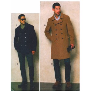 May include: Two men wearing different styles of double-breasted coats. The man on the left is wearing a navy blue coat with a turtleneck sweater underneath. The man on the right is wearing a brown coat with a white collared shirt underneath. Both men are wearing dark jeans and brown shoes.
