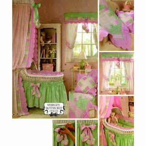 May include: A set of baby crib bedding with a pink and green patchwork design. The bedding includes a canopy, a crib skirt, a pillow, and a quilt. The bedding is decorated with scalloped edges and bows. The bedding is made by Shirley Botsford Designs.