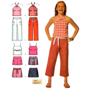 May include: A sewing pattern for a girl's halter top and trousers or skirt. The pattern includes five different top and bottom combinations. The tops are all halter tops with different necklines and straps. The bottoms include trousers, shorts, and a skirt. The pattern is designed by Karen Z.