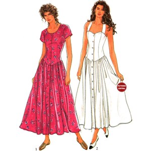 Peut inclure: Deux robes pour femmes, l'une à imprimé floral rose et l'autre blanche. Les deux robes ont un devant boutonné et une jupe ample.