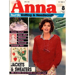 May include: A magazine cover for Anna burda Knitting & Needlecrafts, featuring a woman wearing a red knitted sweater. The cover text reads "Jackets & Sweaters" and "A success - even for beginners".