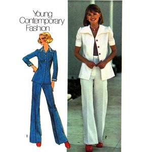 May include: Two women wearing trouser suits. The woman on the left is wearing a blue trouser suit with a white blouse. The woman on the right is wearing a white trouser suit with a white blouse and a red striped shirt. Both women are wearing red shoes.