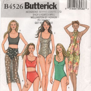 May include: A sewing pattern for four different swimsuit styles. The pattern is for sizes 6-8-10-12 and is from Butterick. The pattern is for a swimsuit with a halter top, a swimsuit with a scoop neck, a swimsuit with a V-neck, and a sarong.